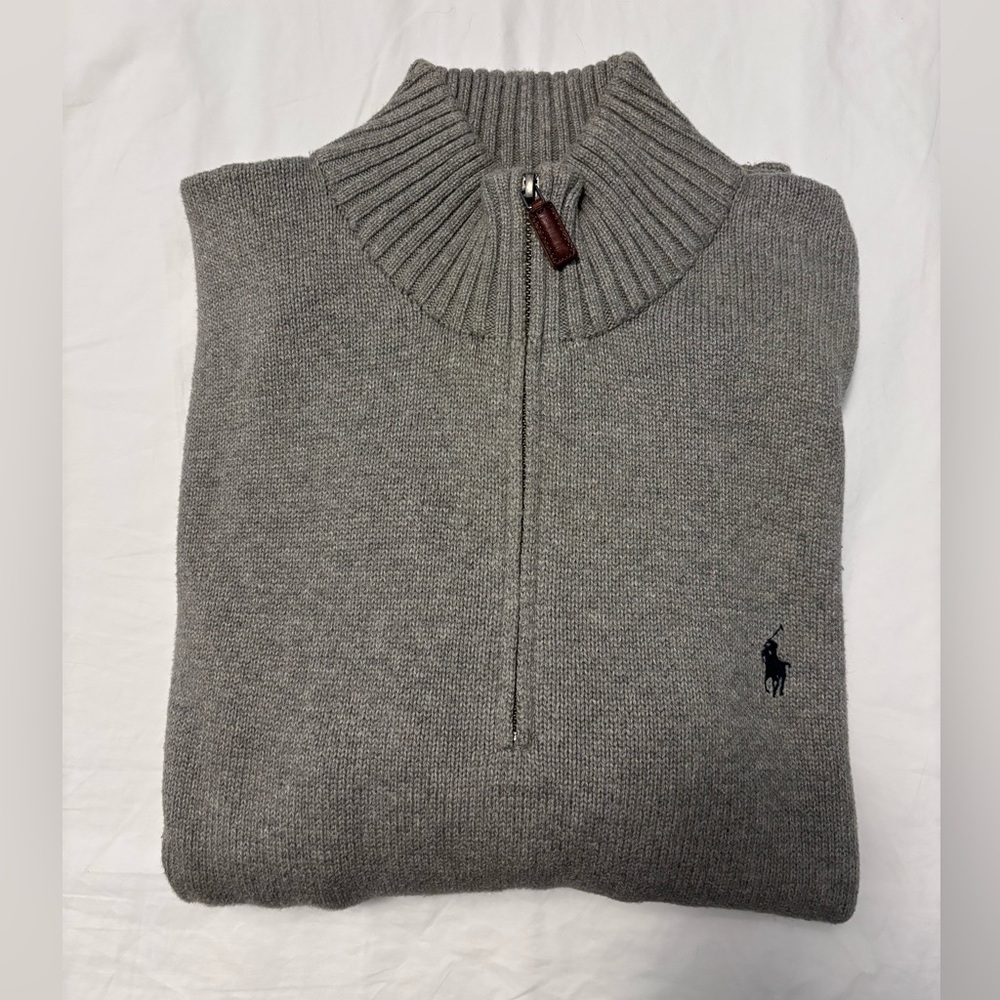Beautiful gray cotton sweater marketed to men.
